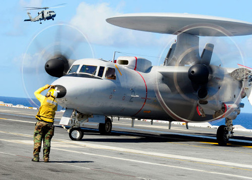 An Aviation Boatswain's Mate directs a French E-2C Hawkeye abord USS Theodore Roosevelt Poster Print by Stocktrek Images - Item # VARPSTSTK104492M An Aviation Boatswain's Mate directs a French E-2C Hawkeye abord USS Theodore Roosevelt Poster Print by Stocktrek Images - Item # VARPSTSTK104492M