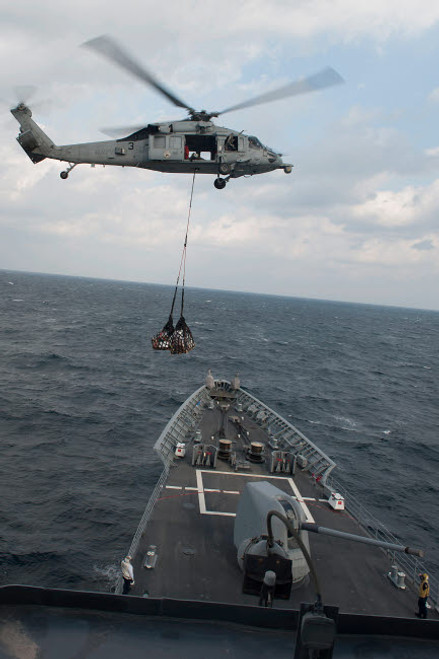 An MH-60S Sea Hawk helicopter delivers supplies to USS Mobile Bay Poster Print by Stocktrek Images - Item # VARPSTSTK106699M