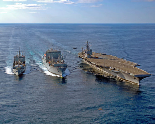 A US Navy MH-60S Knighthawk helicopter conducts vertical replenishment drills Poster Print by Stocktrek Images - Item # VARPSTSTK102226M