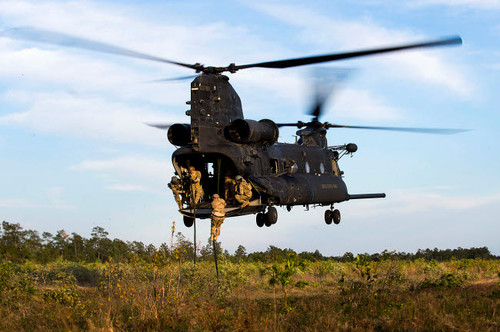 US Army Soldiers fast-rope out of a CH-47 Chinook Poster Print by Stocktrek Images - Item # VARPSTSTK108864M