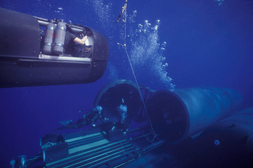 SEAL Delivery Vehicle hovers in mid-water on tether to the Dry Deck Shelter Poster Print by Michael Wood/Stocktrek Images - Item # VARPSTWOD100207M