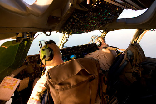 US Army Pilots in-flight in the cockpit of a C-17 Globemaster III during a mission to Qatar Poster Print by Terry Moore/Stocktrek Images - Item # VARPSTTMO100122M