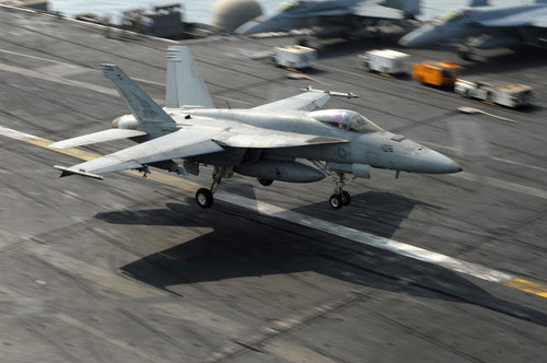 An F/A-18E Super Hornet lands aboard USS Dwight D Eisenhower Poster Print by Stocktrek Images - Item # VARPSTSTK106646M