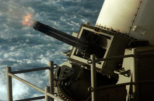 A 20mm automatic machine gun being fired aboard USS Kitty Hawk Poster Print by Stocktrek Images - Item # VARPSTSTK100625M