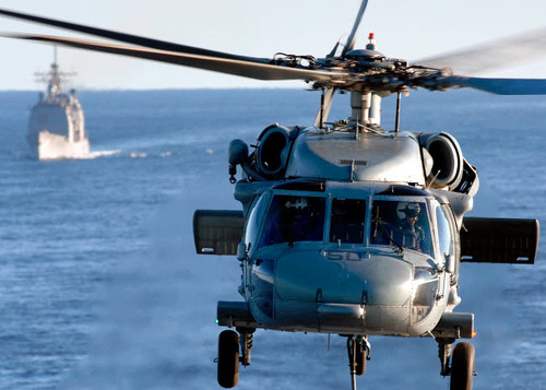 An MH-60S Seahawk helps conduct a vertical replenishment Poster Print by Stocktrek Images - Item # VARPSTSTK101267M