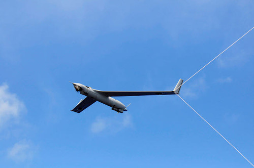 A Scan Eagle Unmanned Aerial Vehicle makes an arrested recovery on the Skyhook recovery system Poster Print by Stocktrek Images - Item # VARPSTSTK104663M