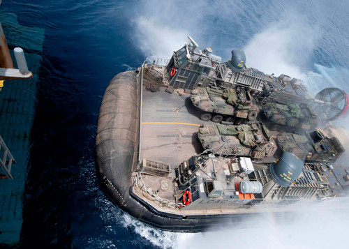 A landing craft air cushion enters teh well deck of USS Iwo Jima Poster Print by Stocktrek Images - Item # VARPSTSTK106374M