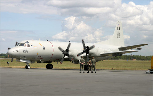 German ground crew members observe a P-3C Orion of the US Navy Poster Print by Timm Ziegenthaler/Stocktrek Images - Item # VARPSTTZG100244M