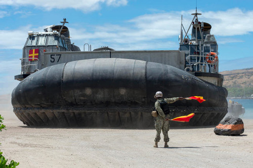 US Navy Seaman directs a landing craft air cushion Poster Print by Stocktrek Images - Item # VARPSTSTK108528M