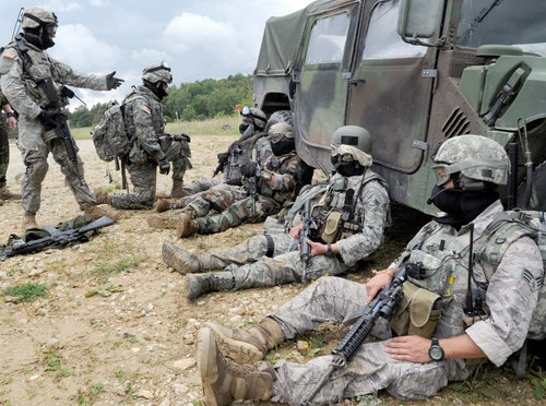 US Air Force and Army members take a rest after an air assault mission Poster Print by Stocktrek Images - Item # VARPSTSTK103837M