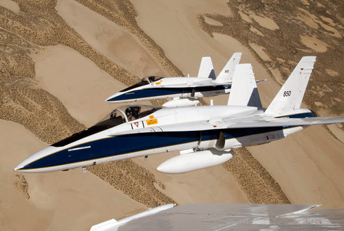 Two Dryden F/A-18s fly in tight formation over the desert Poster Print by Stocktrek Images - Item # VARPSTSTK102615M