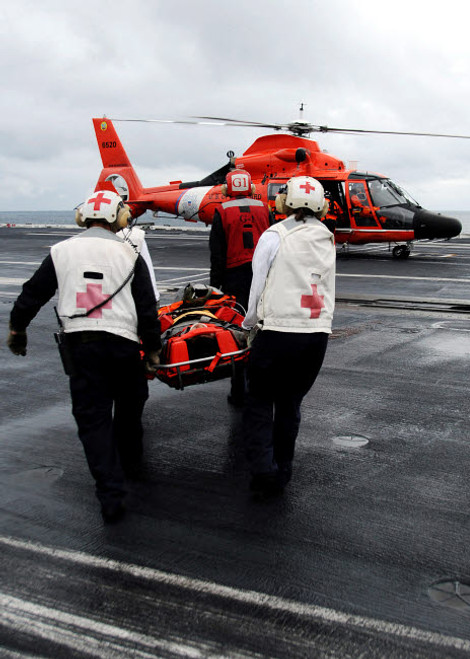 Personnel carry an injured sailor to a coast guard MH-65 Dolphin helicopter Poster Print by Stocktrek Images - Item # VARPSTSTK103300M Personnel carry an injured sailor to a coast guard MH-65 Dolphin helicopter Poster Print by Stocktrek Images - Item # VARPSTSTK103300M