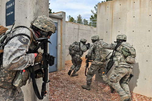 Air Force Reserve security forces members raid an enemy compound Poster Print by Stocktrek Images - Item # VARPSTSTK108279M