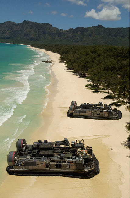 US Navy Landing Craft land on the beach to offload equipment in Oahu, Hawaii Poster Print by Stocktrek Images - Item # VARPSTSTK103054M