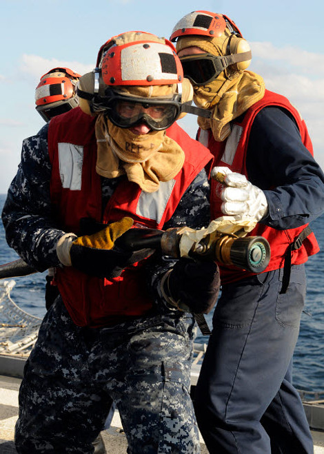 Damage Controlman practices firefighting techniques Poster Print by Stocktrek Images - Item # VARPSTSTK105575M