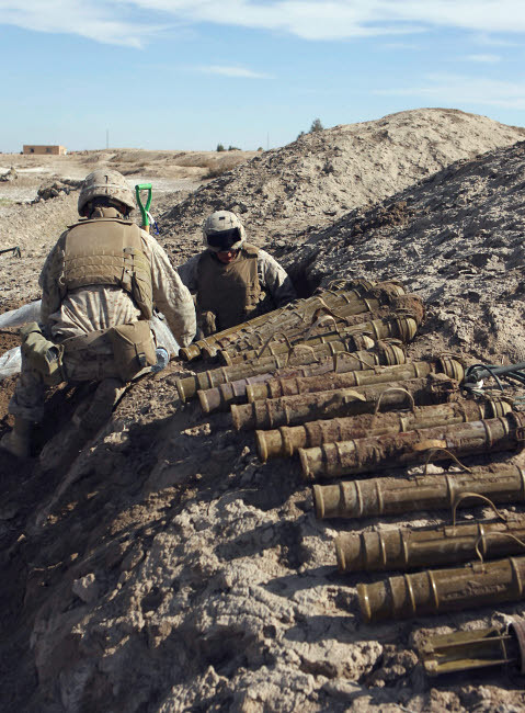 Soldiers unearth 82mm Chinese mortars from a weapons cache Poster Print by Stocktrek Images - Item # VARPSTSTK102532M