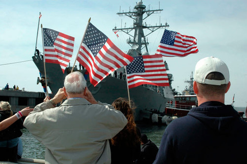 Family members wave flags to show their support Poster Print by Stocktrek Images - Item # VARPSTSTK101253M