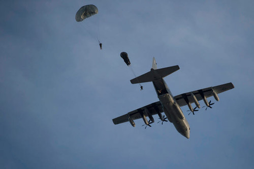 Personnel jump from a C-130 Hercules during a static-line jump Poster Print by Stocktrek Images - Item # VARPSTSTK108832M