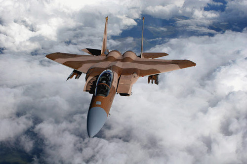 An F-15C Aggressor flies over a mountain range Poster Print by Stocktrek Images - Item # VARPSTSTK102559M