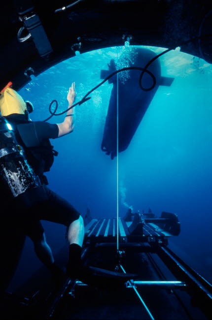 A SEAL Delivery Vehicle breaks away from the Dry Deck Shelter on a submarine Poster Print by Michael Wood/Stocktrek Images - Item # VARPSTWOD100095M