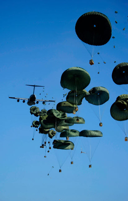 A US Air Force C-17 Globemaster III aircraft airdrops humanitarian aid into Port-au-Prince, Haiti Poster Print by Stocktrek Images - Item # VARPSTSTK103430M A US Air Force C-17 Globemaster III aircraft airdrops humanitarian aid into Port-au-Prince, Haiti Poster Print by Stocktrek Images - Item # VARPSTSTK103430M