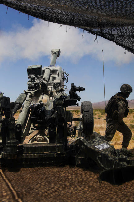 US Marines fire an M777 howitzer Poster Print by Stocktrek Images - Item # VARPSTSTK103846M