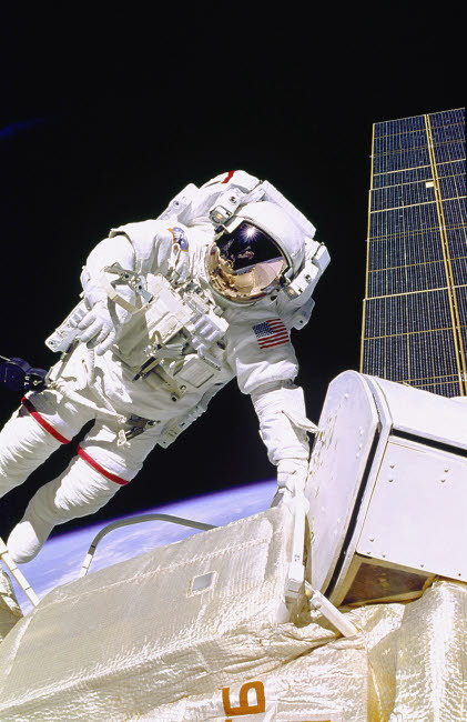 An astronaut working on a space station during extravehicular activity Poster Print by Stocktrek Images - Item # VARPSTSTK200208S