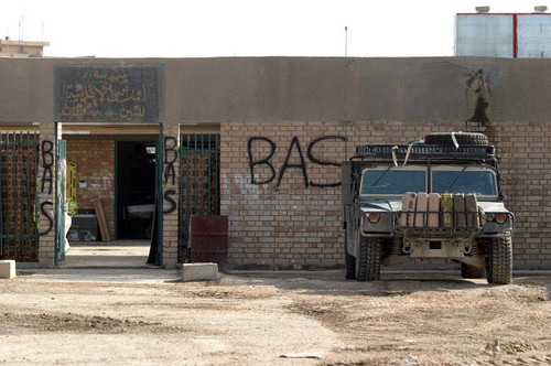 A M998 humvee parked outside an abandoned school Poster Print by Stocktrek Images - Item # VARPSTSTK106108M