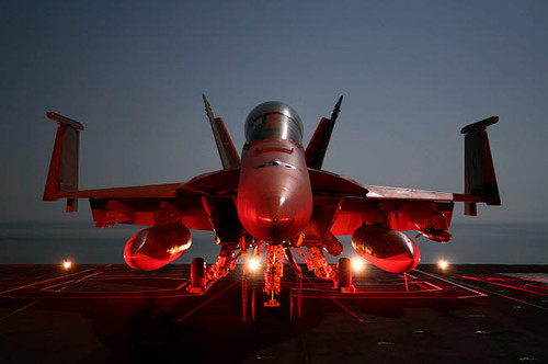 An F/A-18F Super Hornet parked on the flight deck of USS Dwight D Eisenhower Poster Print by Stocktrek Images - Item # VARPSTSTK101953M
