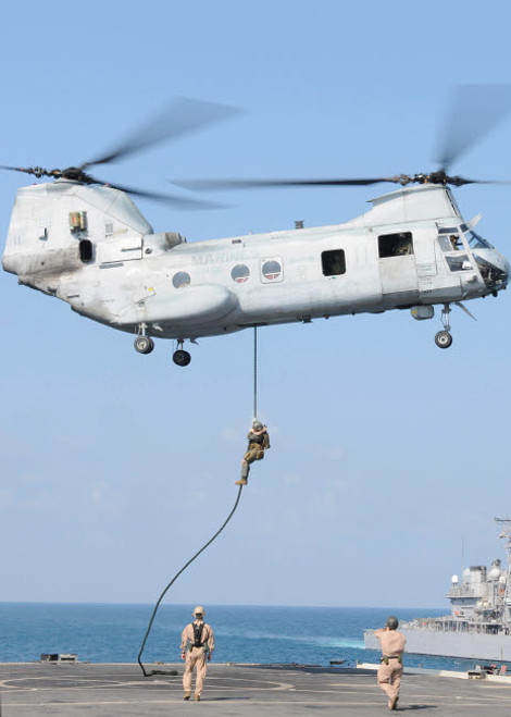Soldiers fast rope from a CH-46E Sea Knight helicopter onto amphibious transport dock USS Denver Poster Print by Stocktrek Images - Item # VARPSTSTK103650M