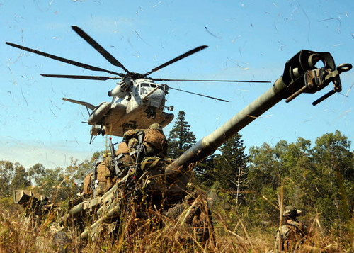 An MH-53E Sea Stallion helicopter preparing to lift an M777 105-mm lightweight Howitzer Poster Print by Stocktrek Images - Item # VARPSTSTK103174M