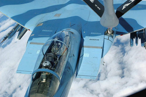 A KC-135 Stratotanker provides in-flight refueling to an F-15 Eagle Poster Print by Stocktrek Images - Item # VARPSTSTK102549M
