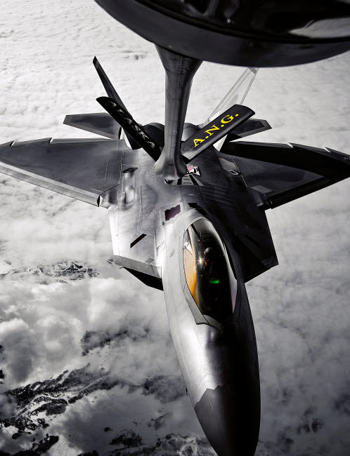 A KC-135 Stratotanker refuels a F-22 Raptor Poster Print by Stocktrek Images - Item # VARPSTSTK102691M