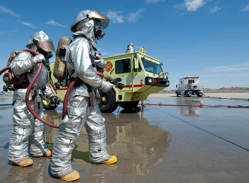 US Marine firefighters stand ready during annual training Poster Print by Stocktrek Images - Item # VARPSTSTK105011M