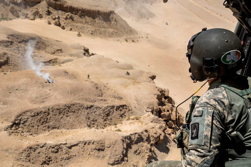A crew chief monitors the surroundings from a SA 330 Puma helicopter Poster Print by Stocktrek Images - Item # VARPSTSTK108664M