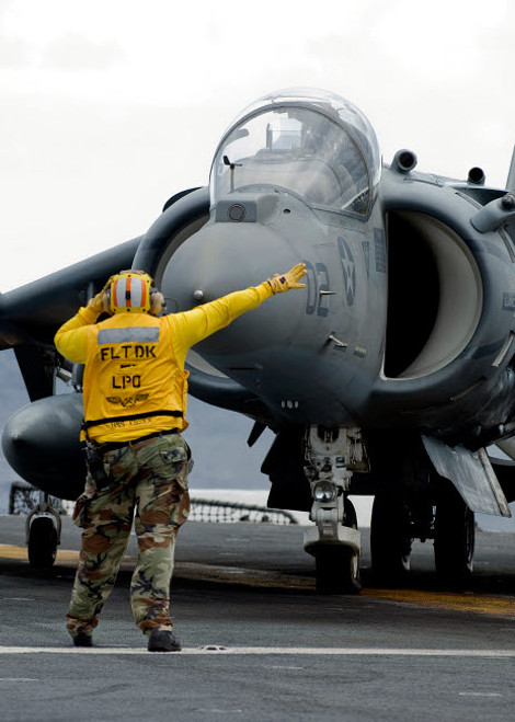Aviation Boatswain's Mate directs the pilot of an AV-8B Harrier II Poster Print by Stocktrek Images - Item # VARPSTSTK104366M Aviation Boatswain's Mate directs the pilot of an AV-8B Harrier II Poster Print by Stocktrek Images - Item # VARPSTSTK104366M