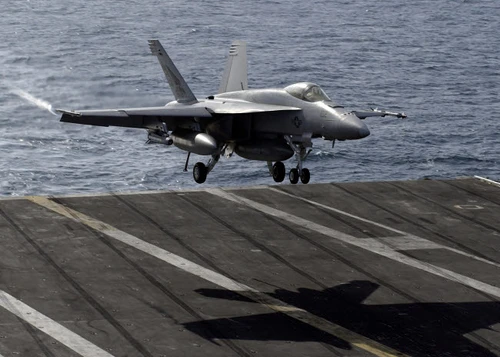 An F/A-18E Super Hornet prepares to land on the flight deck aboard USS Dwight D Eisenhower Poster Print by Stocktrek Images - Item # VARPSTSTK102106M