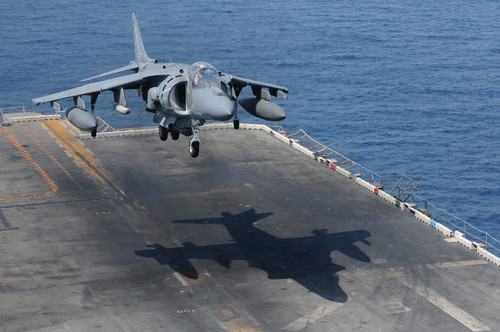 An AV-8B Harrier aircraft lands on the flight deck of USS Peleliu Poster Print by Stocktrek Images - Item # VARPSTSTK103940M An AV-8B Harrier aircraft lands on the flight deck of USS Peleliu Poster Print by Stocktrek Images - Item # VARPSTSTK103940M