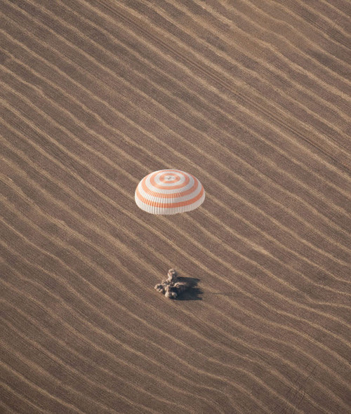 The Soyuz TMA-14 spacecraft lands in Kazakhstan Poster Print by Stocktrek Images