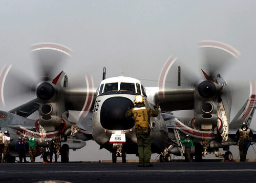 Airman directs the movement of a C-2 Greyhound on the flight deck of USS Harry S Truman Poster Print by Stocktrek Images - Item # VARPSTSTK100772M