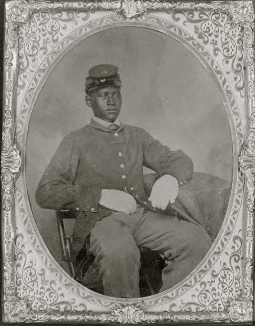 African American soldier, three-quarter length portrait, wearing uniform and gloves, seated, facing slightly right. Poster Print - Item # VARBLL0587634073