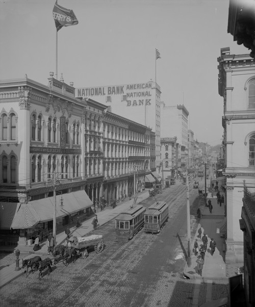 Main Street in Richmond, Virginia before the age of Bank Bailouts.  Public Transportation  Dominates the street with very little vehicular traffic besides. Many of the Buildings are cast iron. Poster Print - Item # VARBLL058746392L