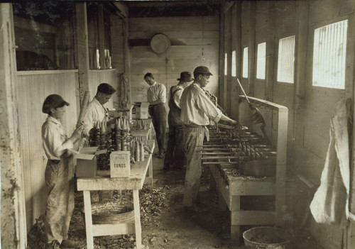 Interior of workshop of Sanitary Ice Cream Cone Co; Young Boy works beside adults Poster Print - Item # VARBLL058746525L