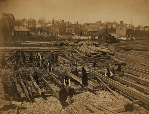 Track near the Potomac River, in Alexandria. Lumber; part of construction force at work Poster Print - Item # VARBLL058745515L