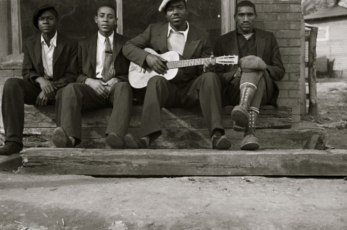 African American on bench while one plays the guitar Poster Print - Item # VARBLL058744882L