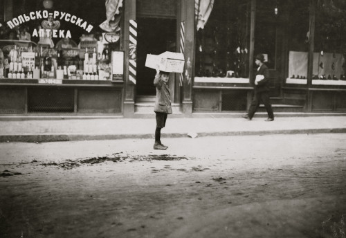 Carrying wood home in front of a Polish & Russian Pharmacy Poster Print - Item # VARBLL058754789L