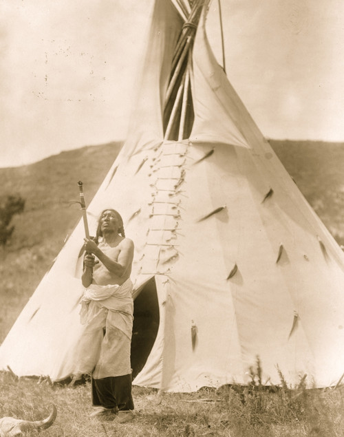 Dakota man standing outside tipi gazing upward. Poster Print - Item # VARBLL058747007L