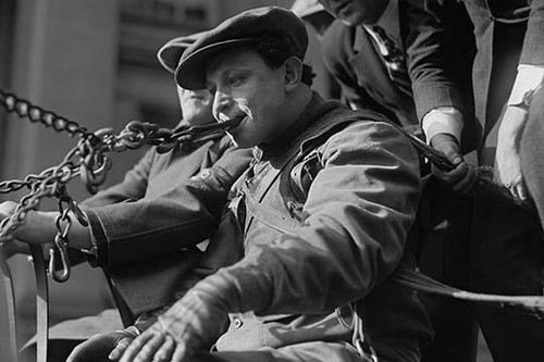 Young Man pulls wagon by a Chain in His mouth; he is harnessed Poster Print by unknown - Item # VARBLL058745867L