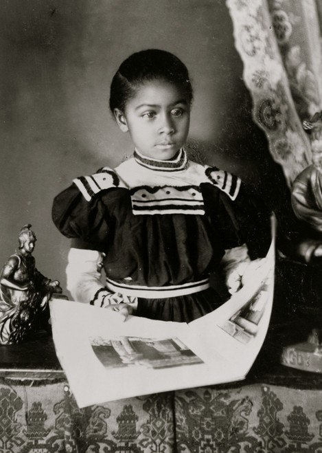 African American girl, half-length portrait, standing at table with illustrated book, facing slightly right Poster Print - Item # VARBLL0587634456