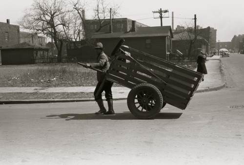 African American pulls a large cart through city streets Poster Print - Item # VARBLL058744941L